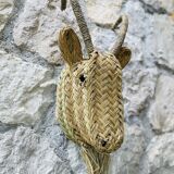 Trophy animal head in palm leaves - Buffalo