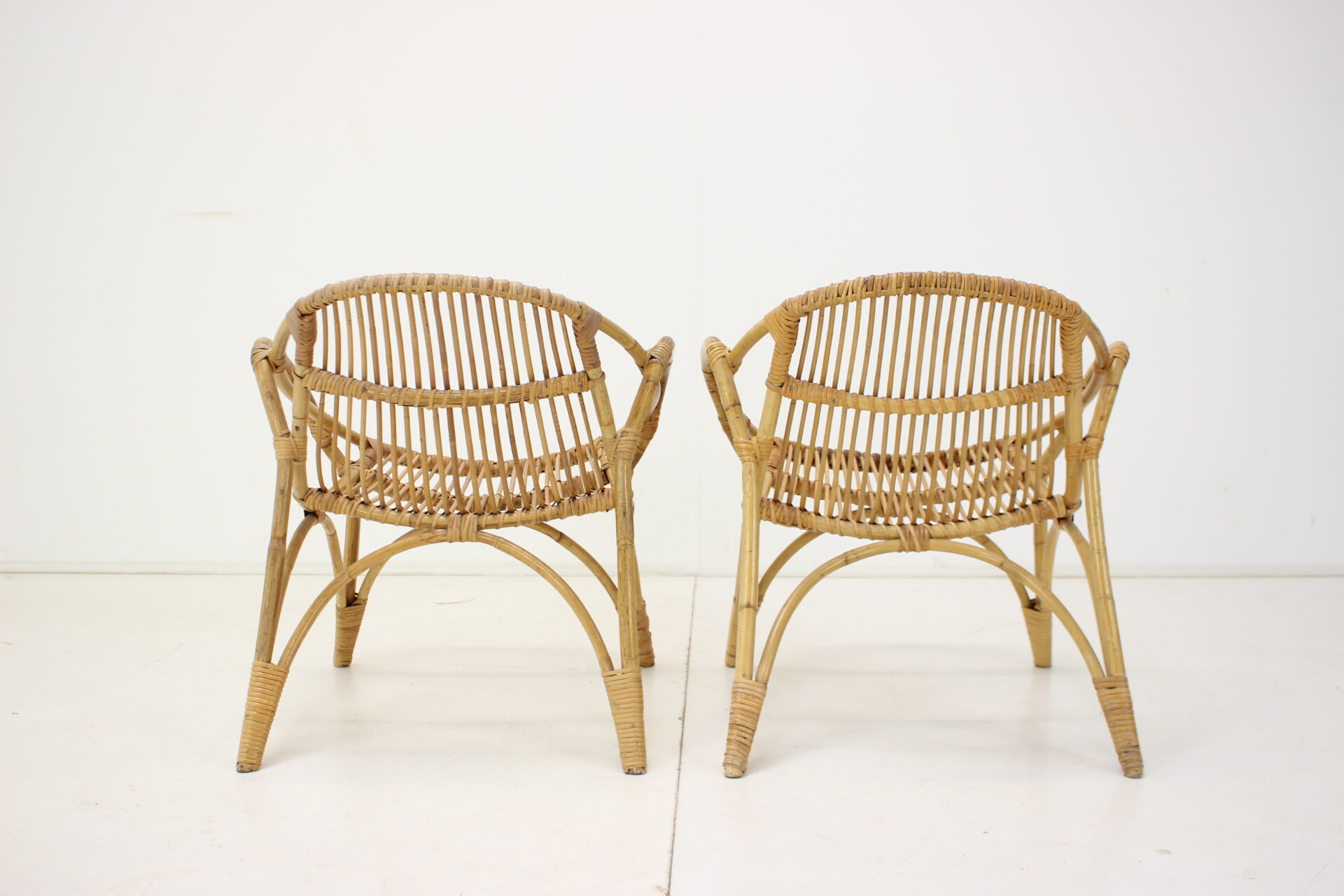 Pair of Alan Fuchs rattan lounge chairs, Czechoslovakia, 1960s
