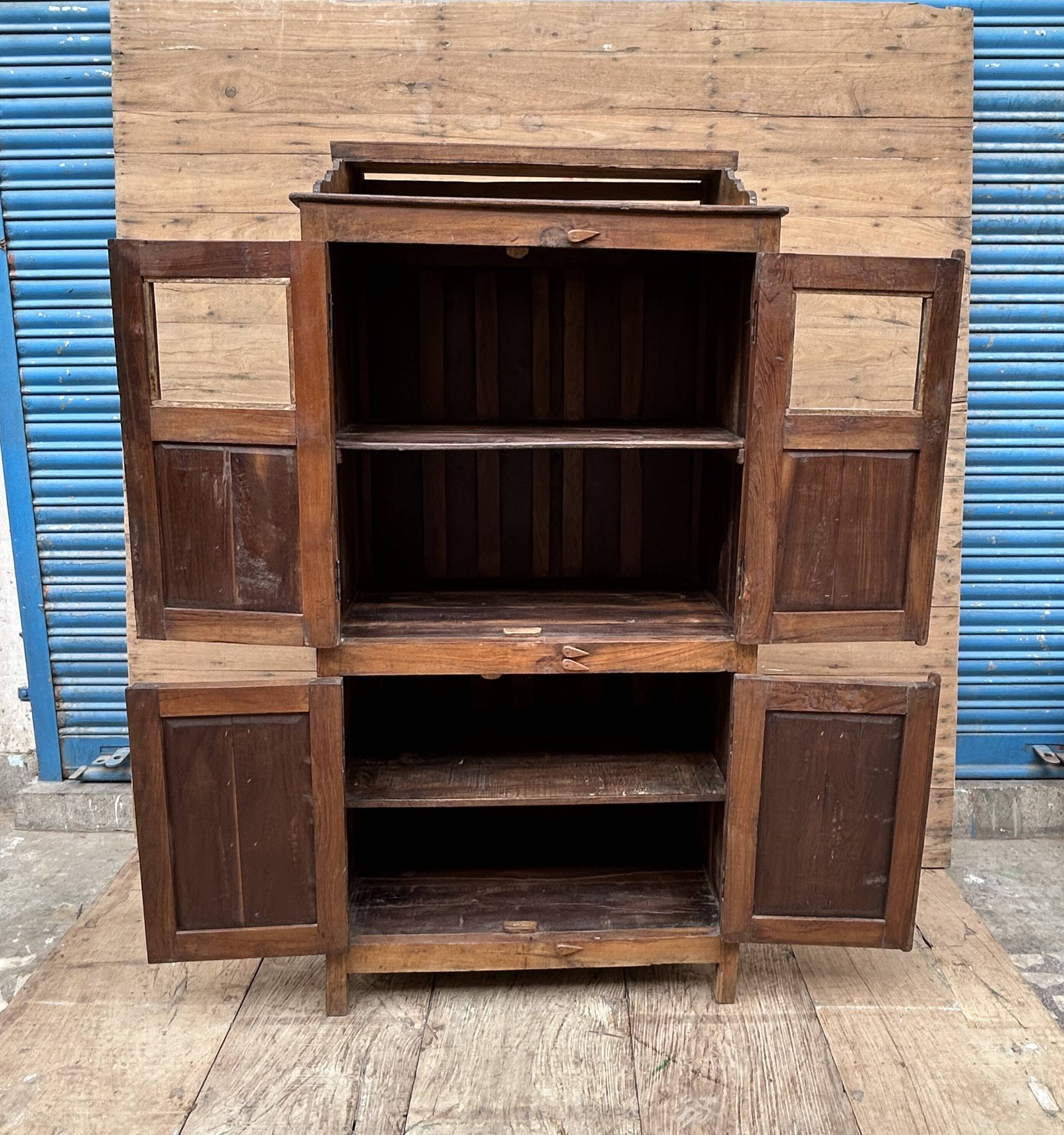 Art Deco glass-fronted cabinet in Burmese teak with original patina.