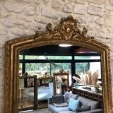 Old mirror 139cm/ 91cm Louis-Philippe with pediment period early 19th, presence of gold leaf.