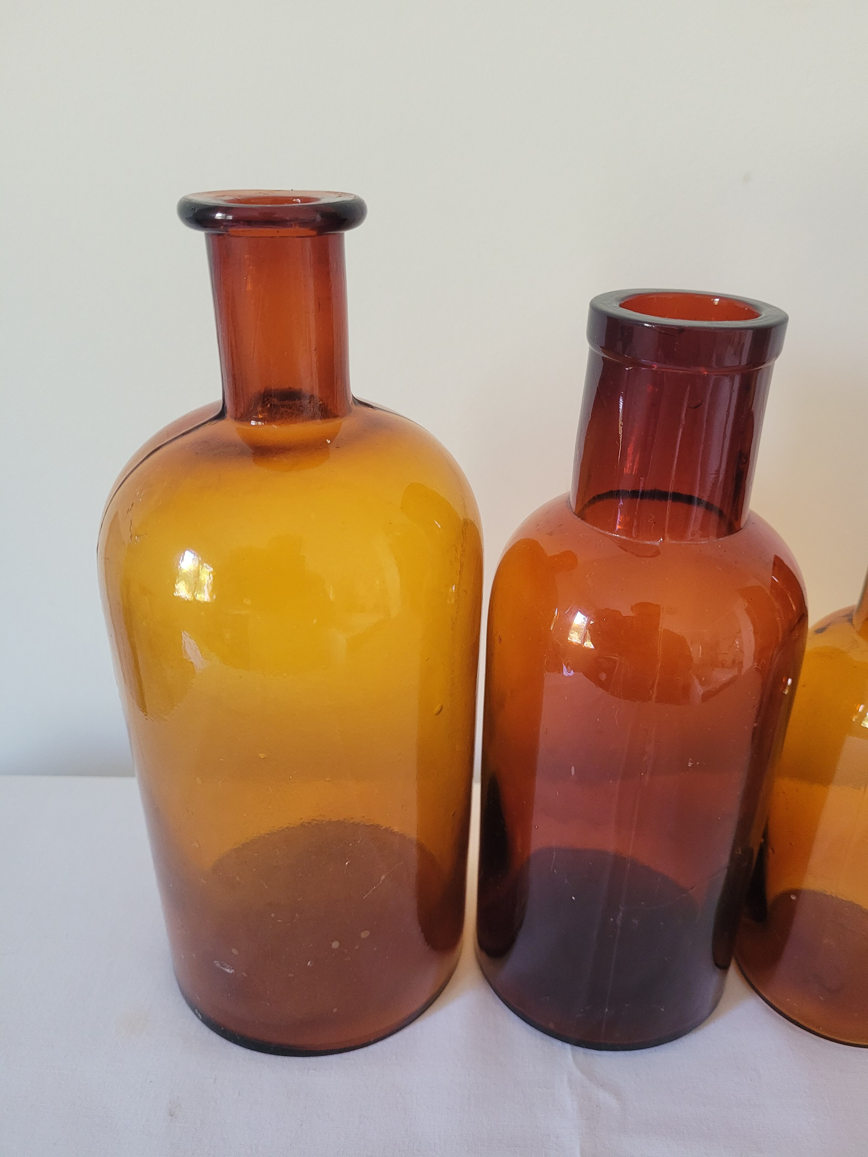 11 bottles of amber glass apothecary