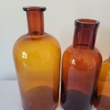 11 bottles of amber glass apothecary