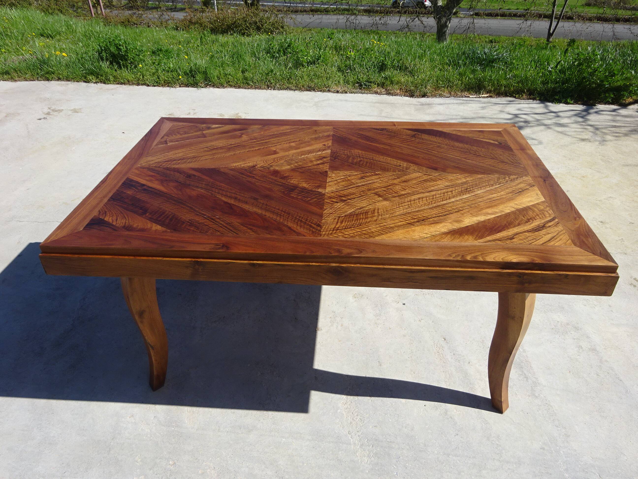 Antique solid walnut table with marquetry and extensions.