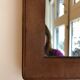 Early 20th century mirror in patinated leather  21x33,5cm
