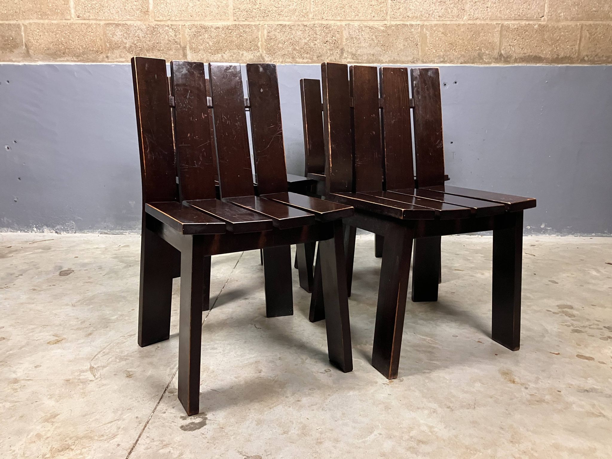 Brutalist and modernist dining chairs from the 1970s in architectural brown wood.
