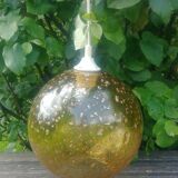 A vintage 70s blown glass pendant light with gold glitter in a globe shape