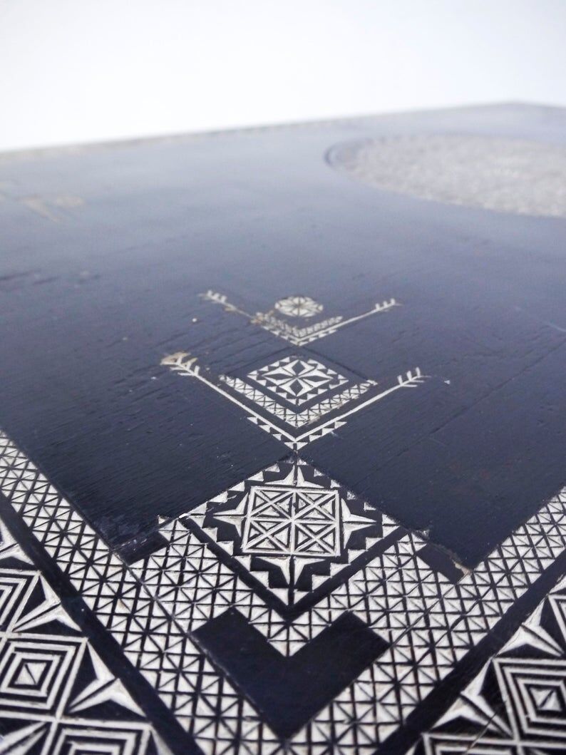 Antique wooden coffee table painted in black and incised with white painted decorations, Ettore Zaccari, Italy c 1910