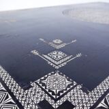 Antique wooden coffee table painted in black and incised with white painted decorations, Ettore Zaccari, Italy c 1910