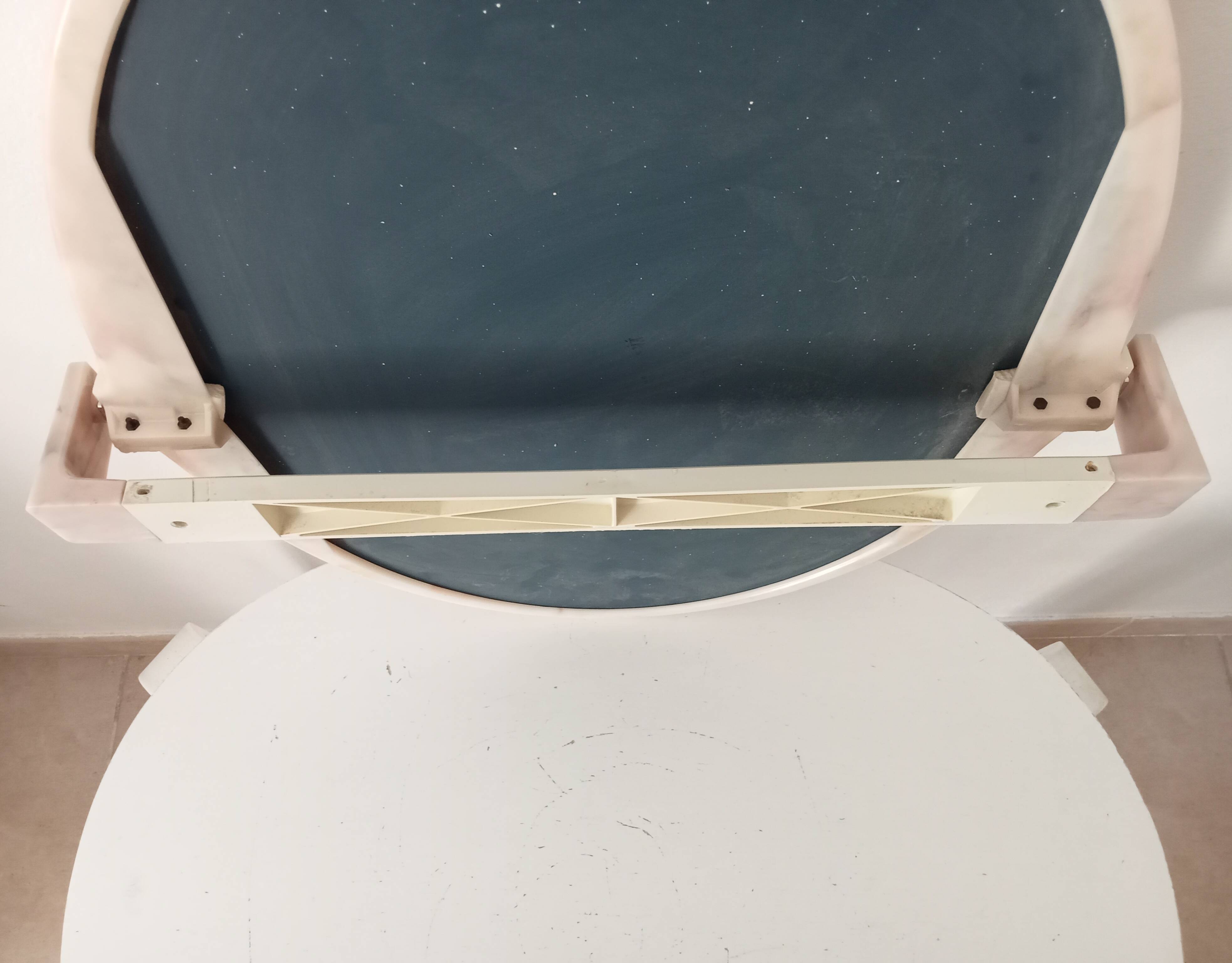 Vintage mirror with a marbled effect from the 70s.