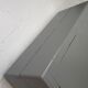Curved wardrobe workshop locker made of wood repainted in grey.