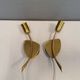 A set of "tulip" wall lamps in golden colored metal. Danish 1970-80s
