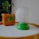 Vintage French table lamp with glass opaline shade and wooden green lamp base.