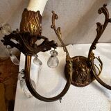 Pair of Louis XV style wall sconces in gilded bronze with glass pendants.