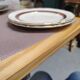 Salins white ceramic dessert plates with red trim and gold rim.