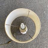 Space age bedside lamp in off-white wood with a metal band.