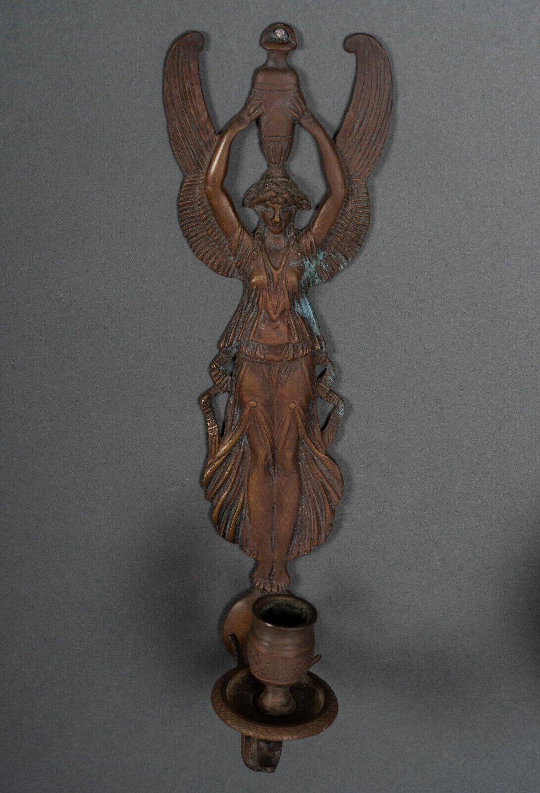 Pair of Empire period bronze sconces decorated with a winged woman