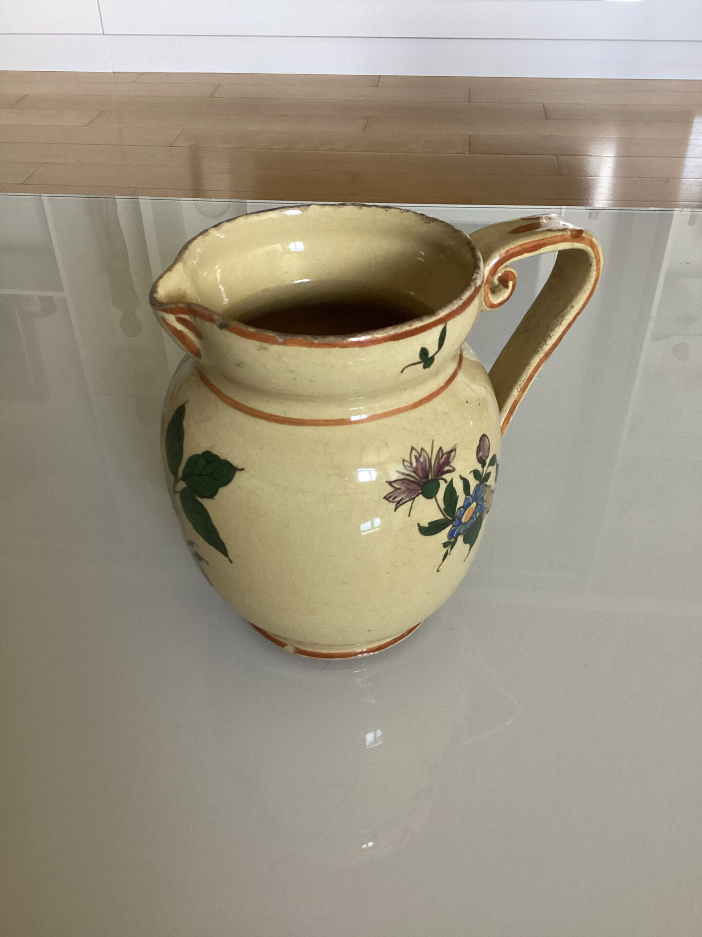 Old ceramic jug with floral decoration