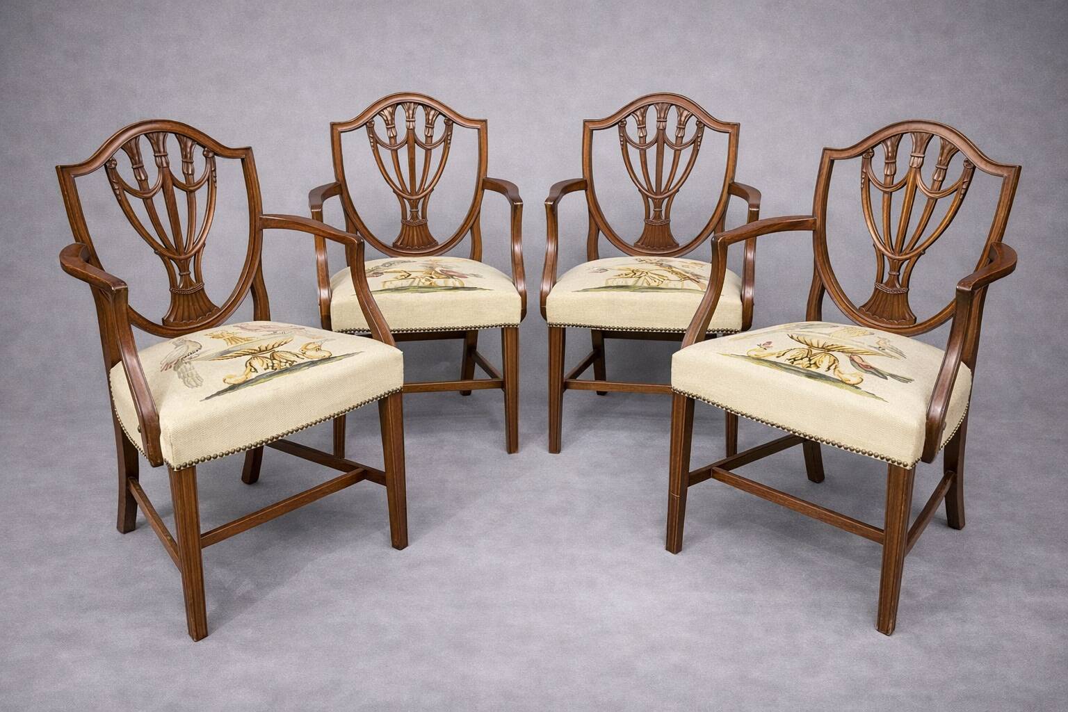 Set of four Sheraton-style armchairs. Solid walnut.