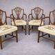 Set of four Sheraton-style armchairs. Solid walnut.