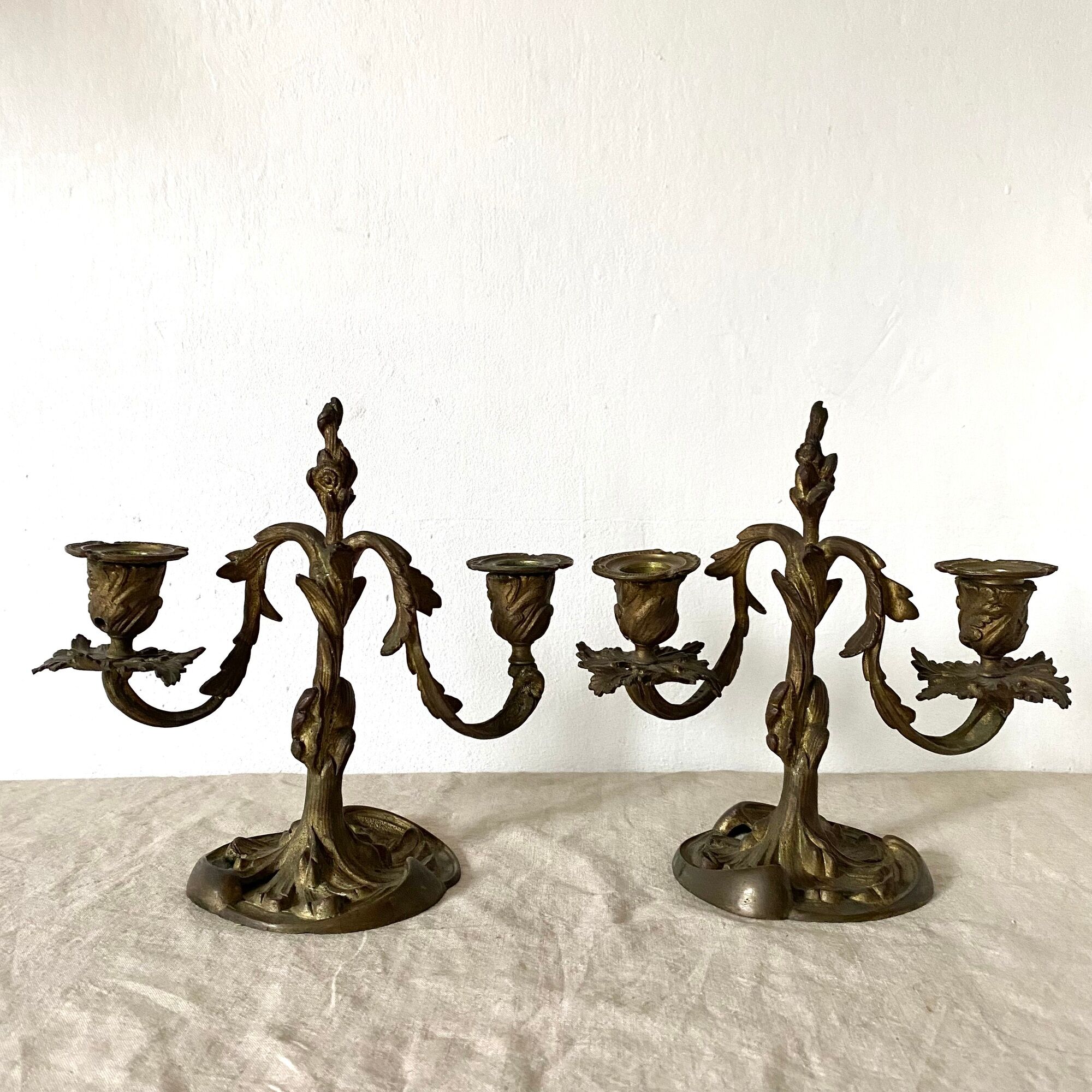 Pair of antique bronze candlesticks at the end of the table XIXth
