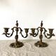 Pair of antique bronze candlesticks at the end of the table XIXth