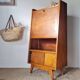 Vintage 1950s wooden secretary with tapered legs and mint interior.