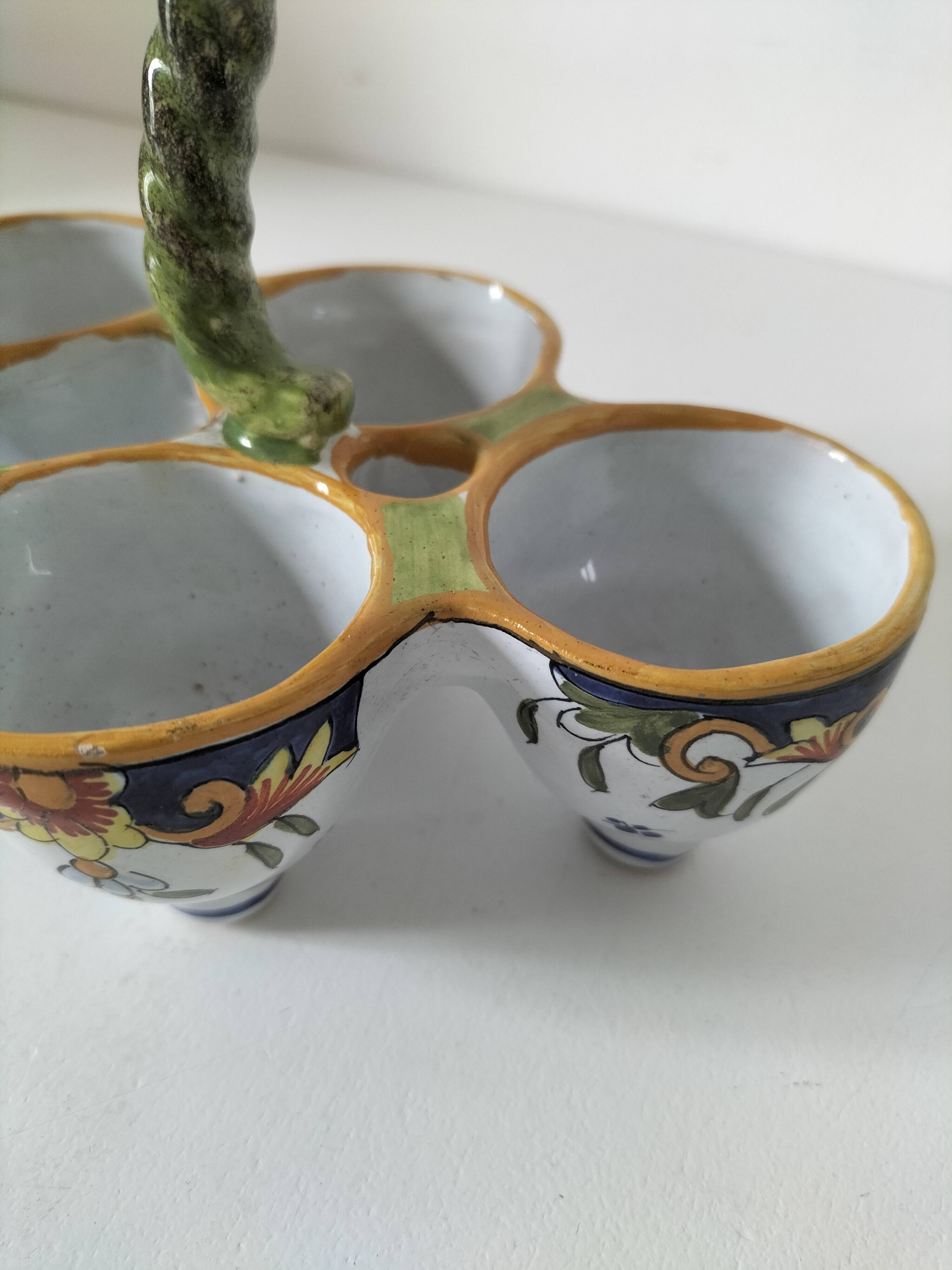 Antique egg holder by Jules Verlingue with polychrome floral decoration.