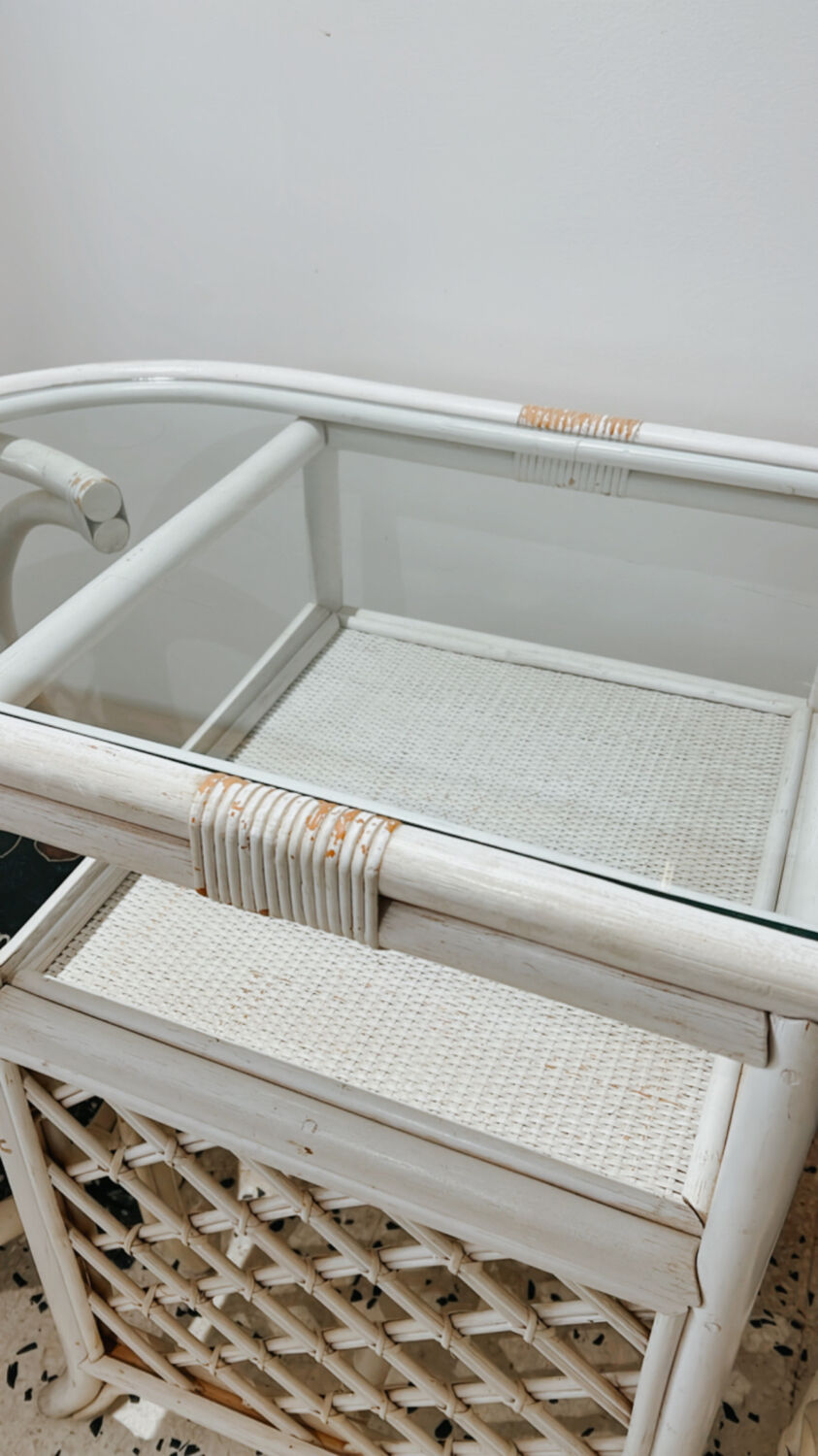 Rattan head-to-head table with vintage armchairs