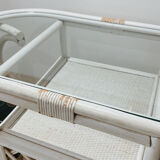 Rattan head-to-head table with vintage armchairs