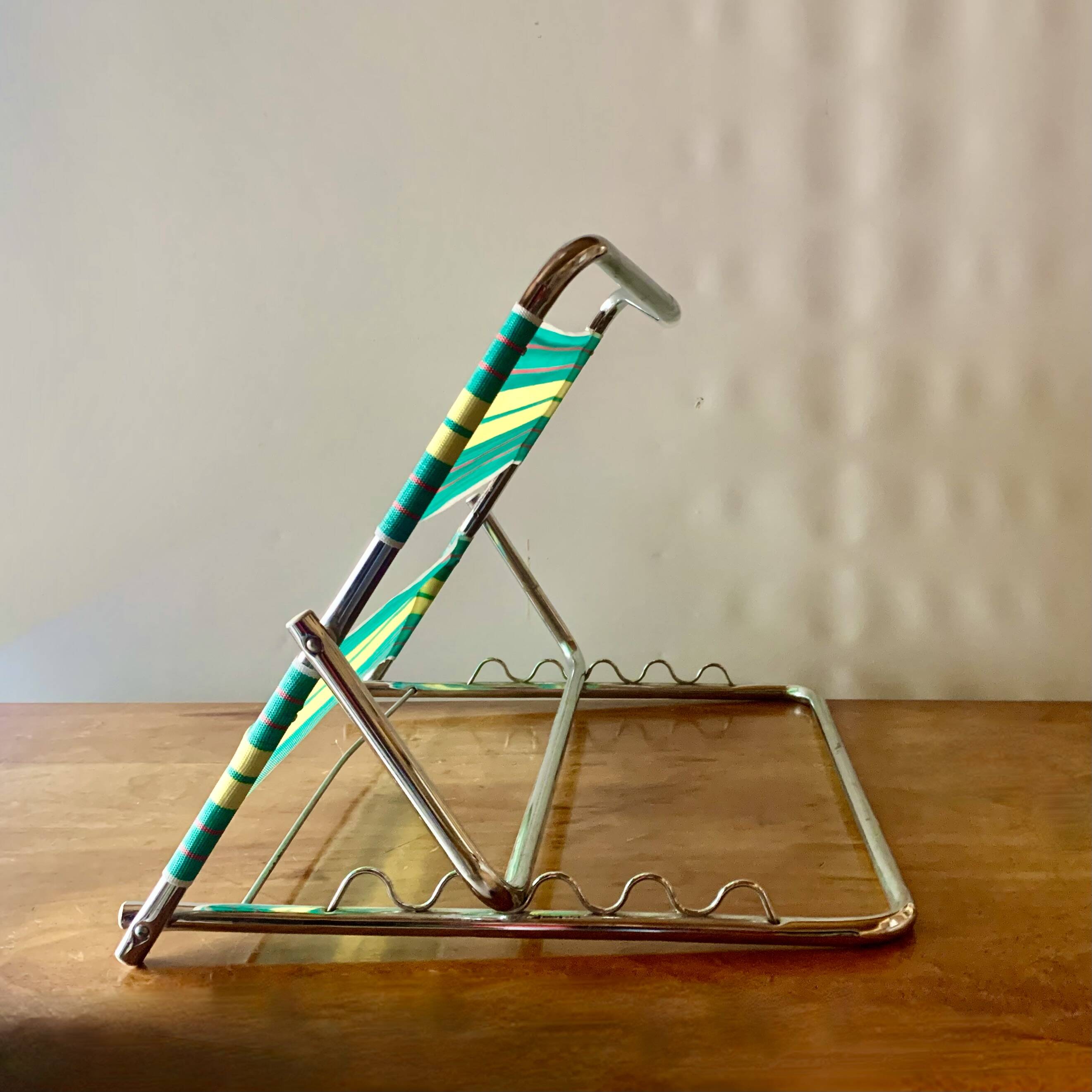 Vintage folding beach chair in chrome metal and woven plastic