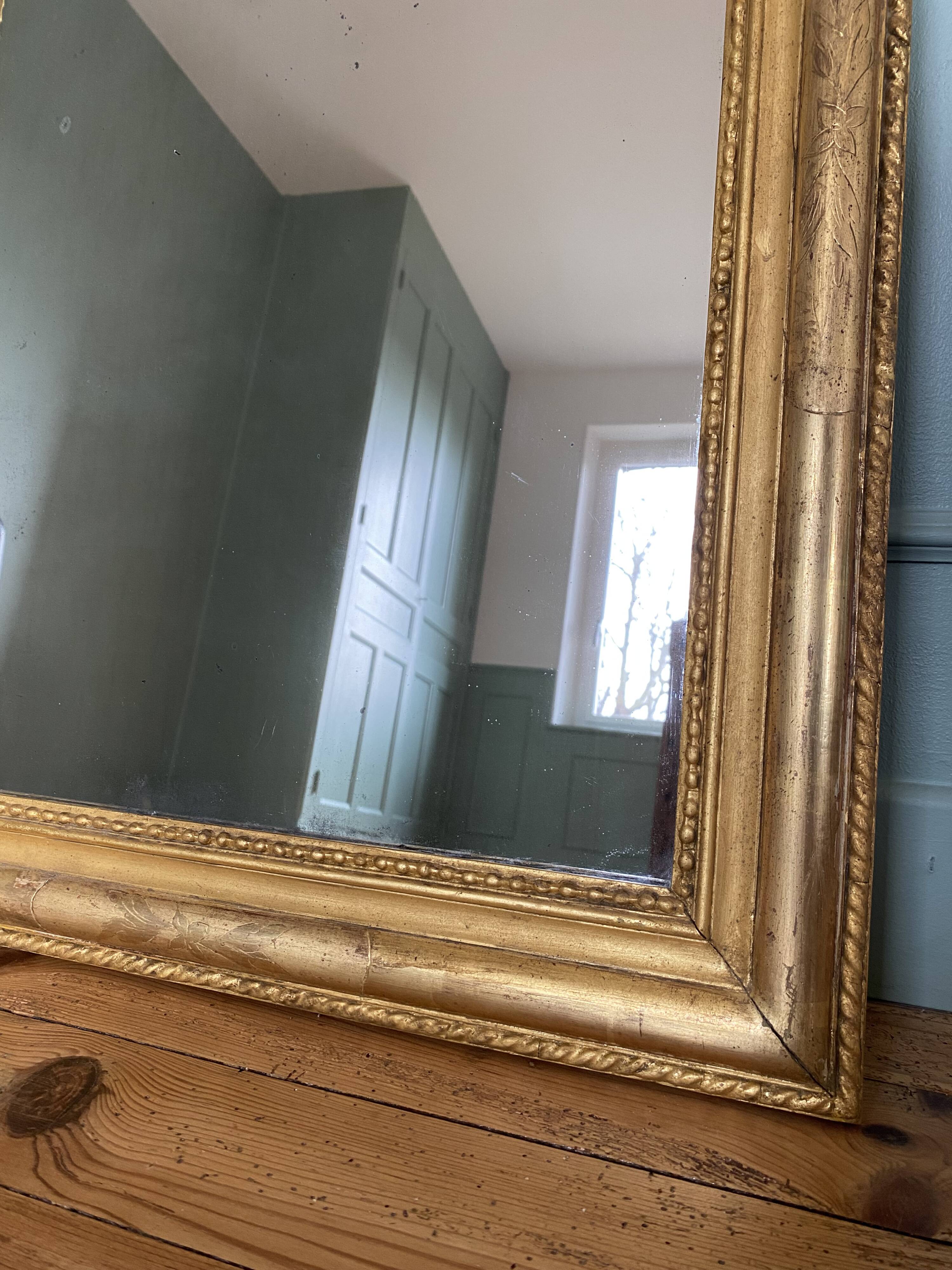 Louis-Philippe mirror gilded with gold leaf