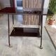 TV stand on casters, 2 brown Formica shelves, 1960s
