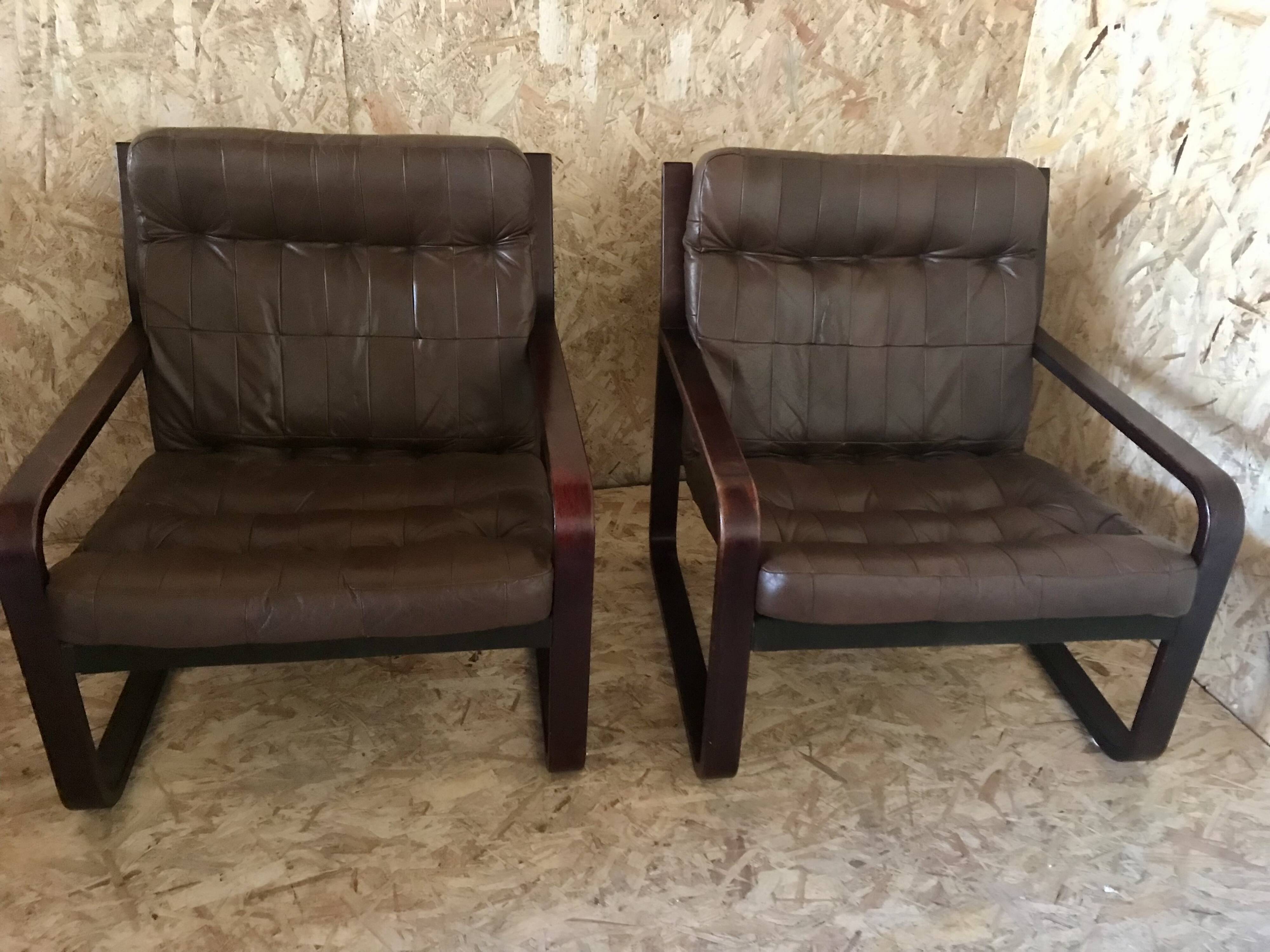 Pair of vintage armchairs in curved wood with suspended seat circa 1970-80.