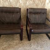 Pair of vintage armchairs in curved wood with suspended seat circa 1970-80.