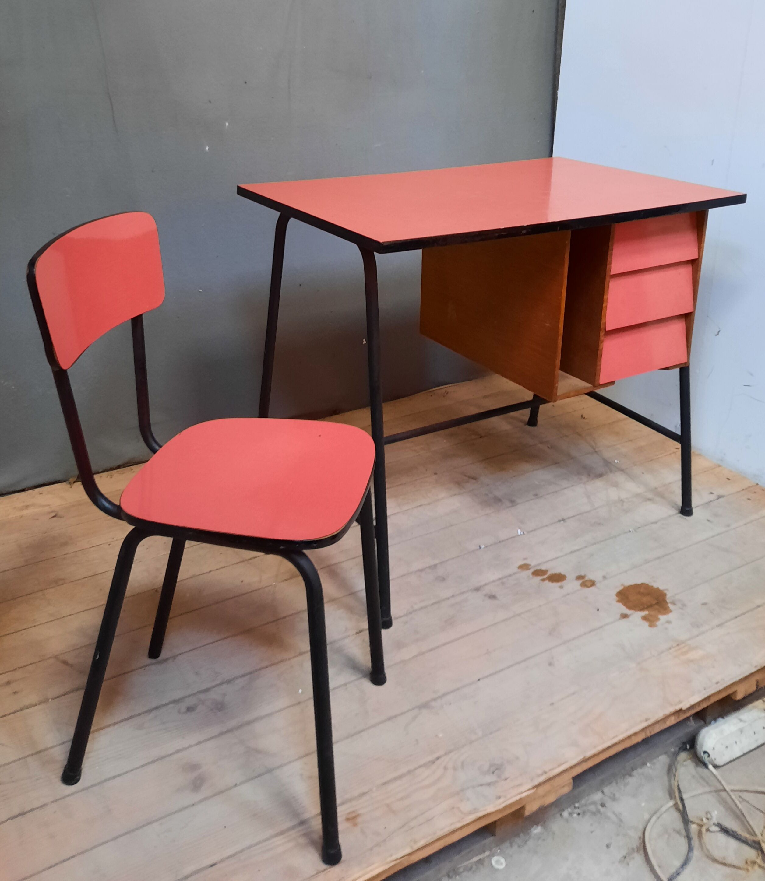 Red vintage desk and its chair