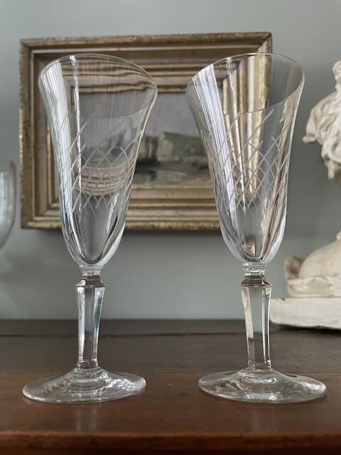 2 antique blown glass champagne flutes, tulip shape.