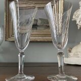 2 antique blown glass champagne flutes, tulip shape.