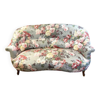 Napoleon III sofa upholstered in a floral patterned fabric