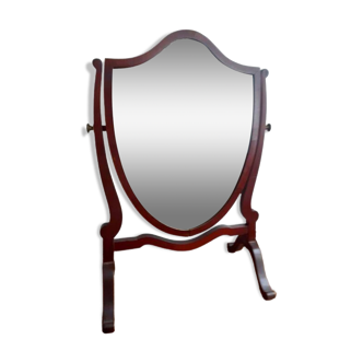 Old beveled dressing table mirror on legs