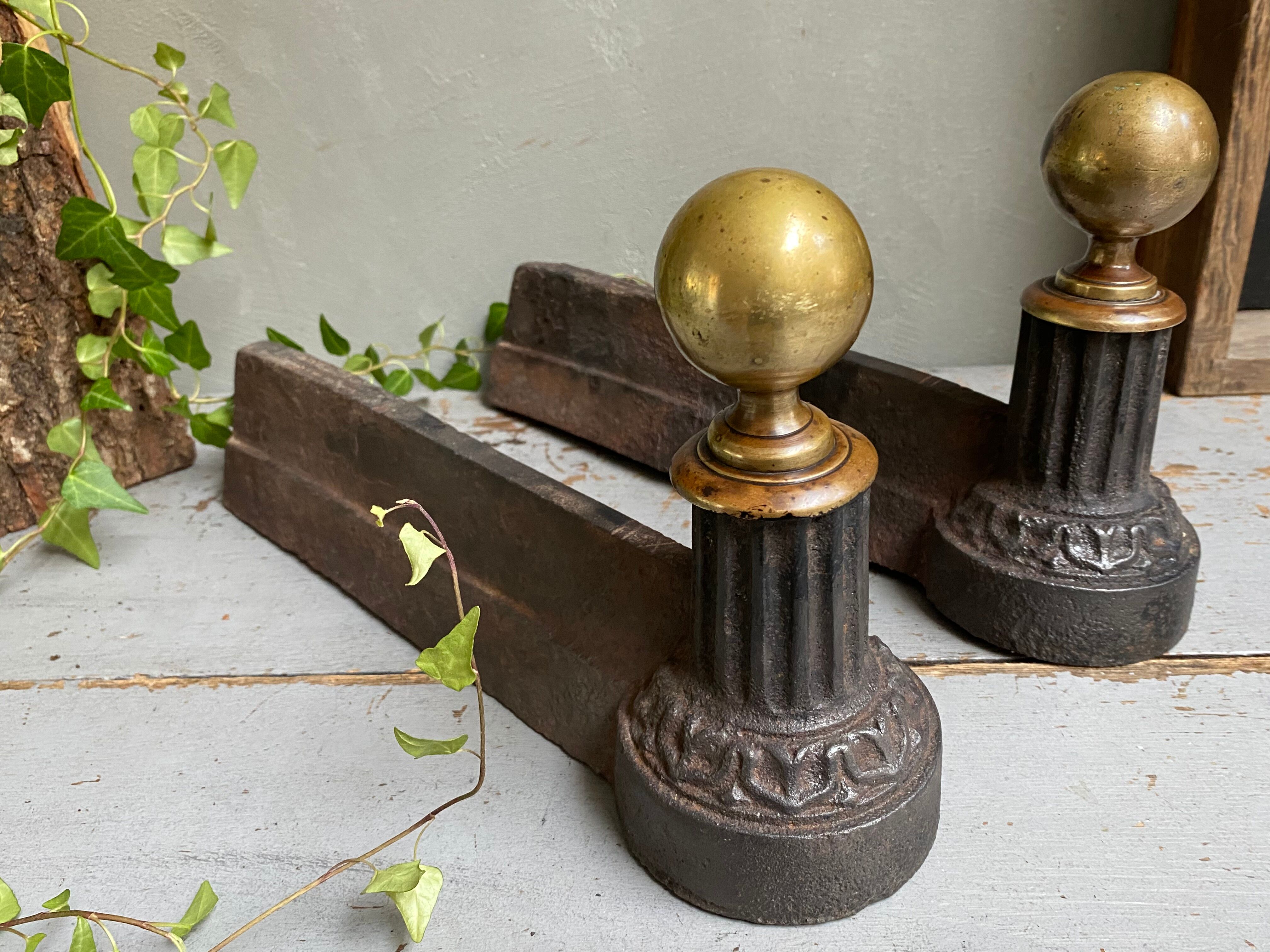 Pair of cast iron and brass chenets