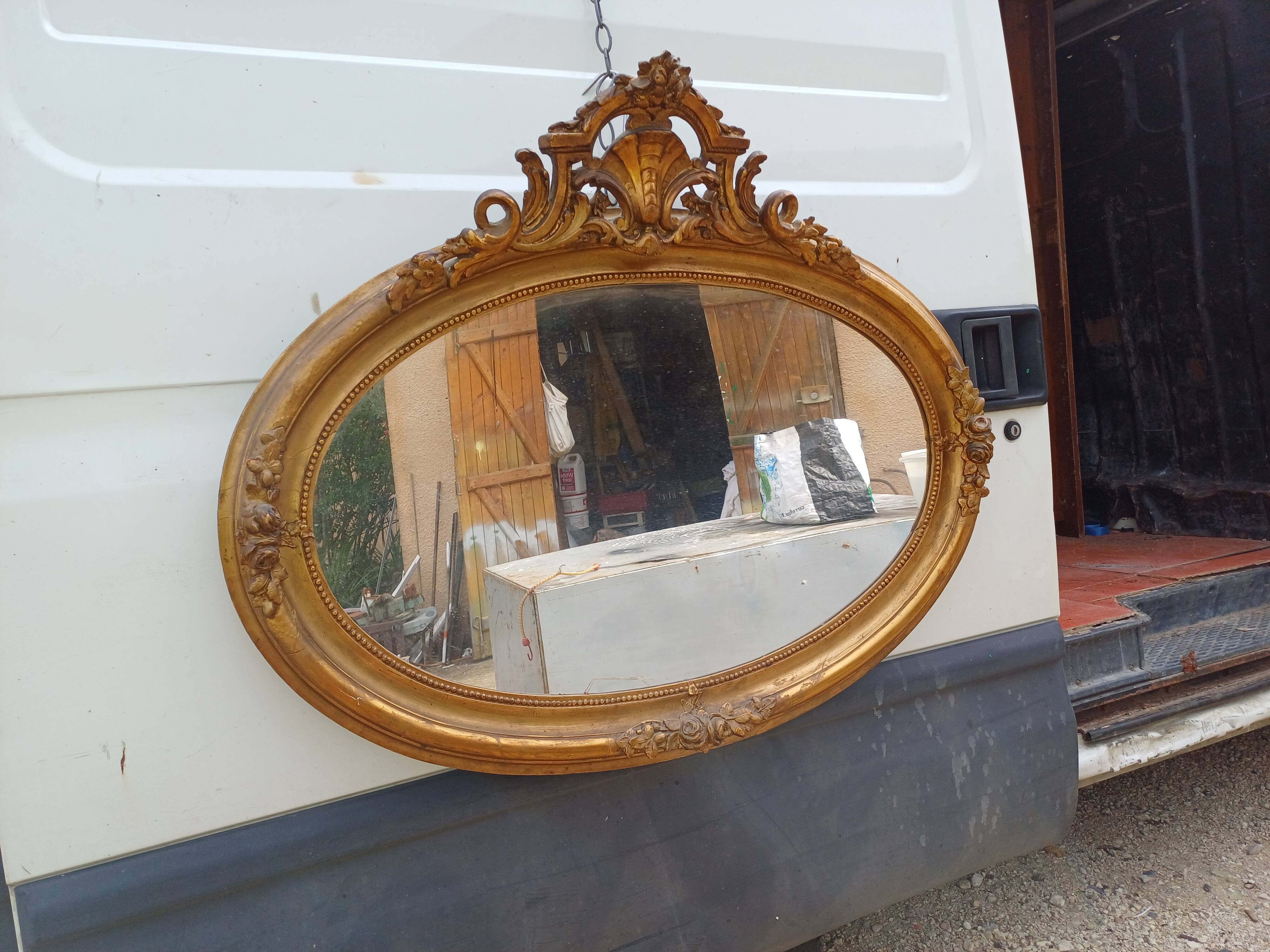 Oval mirror wood and gilded stucco 19th century