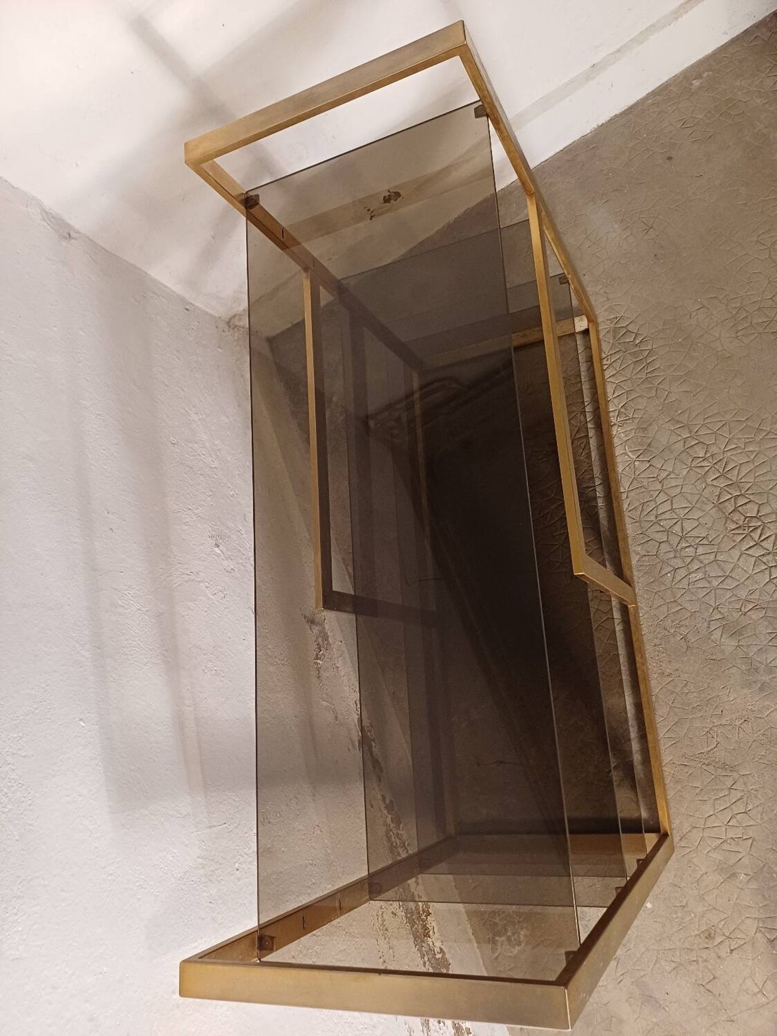 Brass shelf, smoked glass
