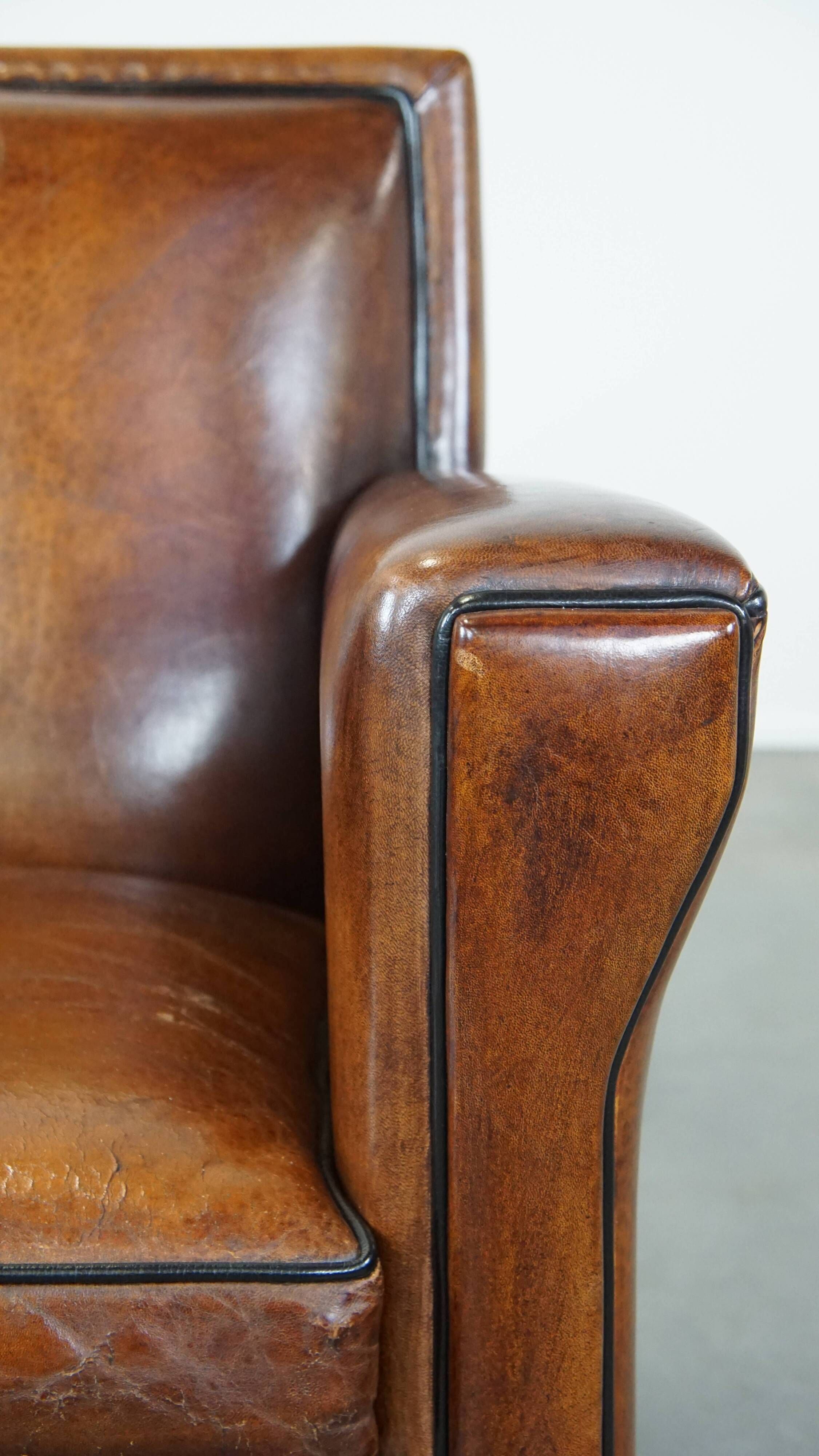Cognac-colored sheep leather Art Deco design armchair finished with piping