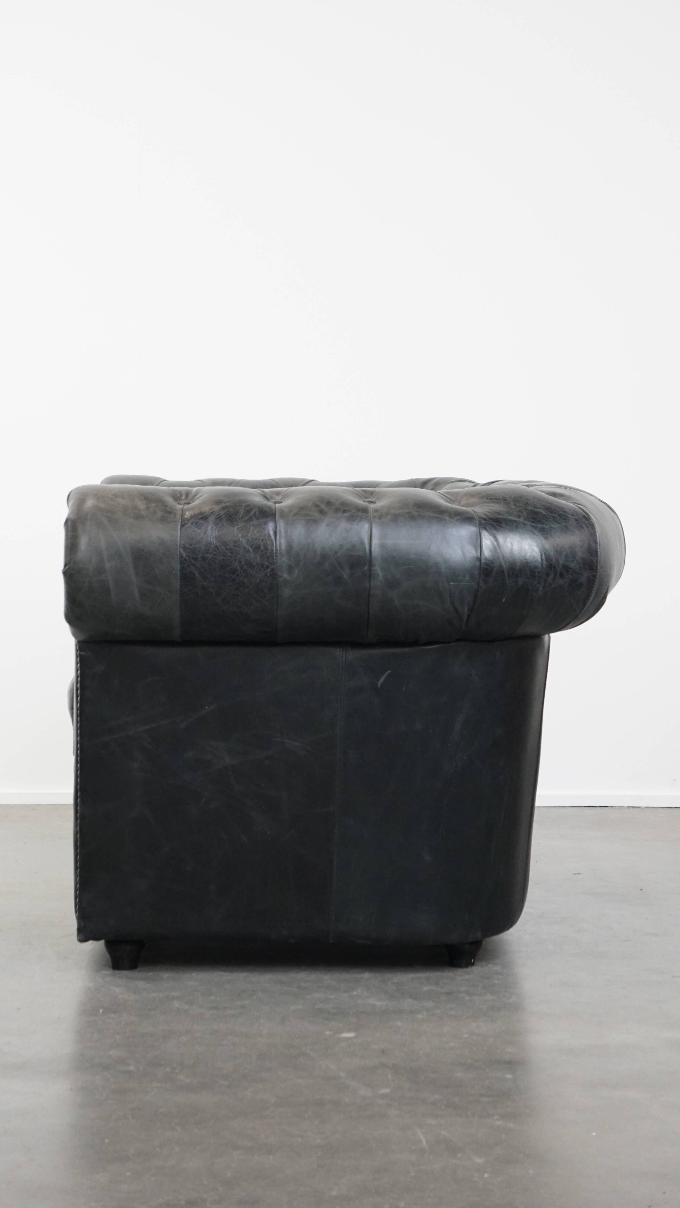 Black cowhide leather chesterfield armchair