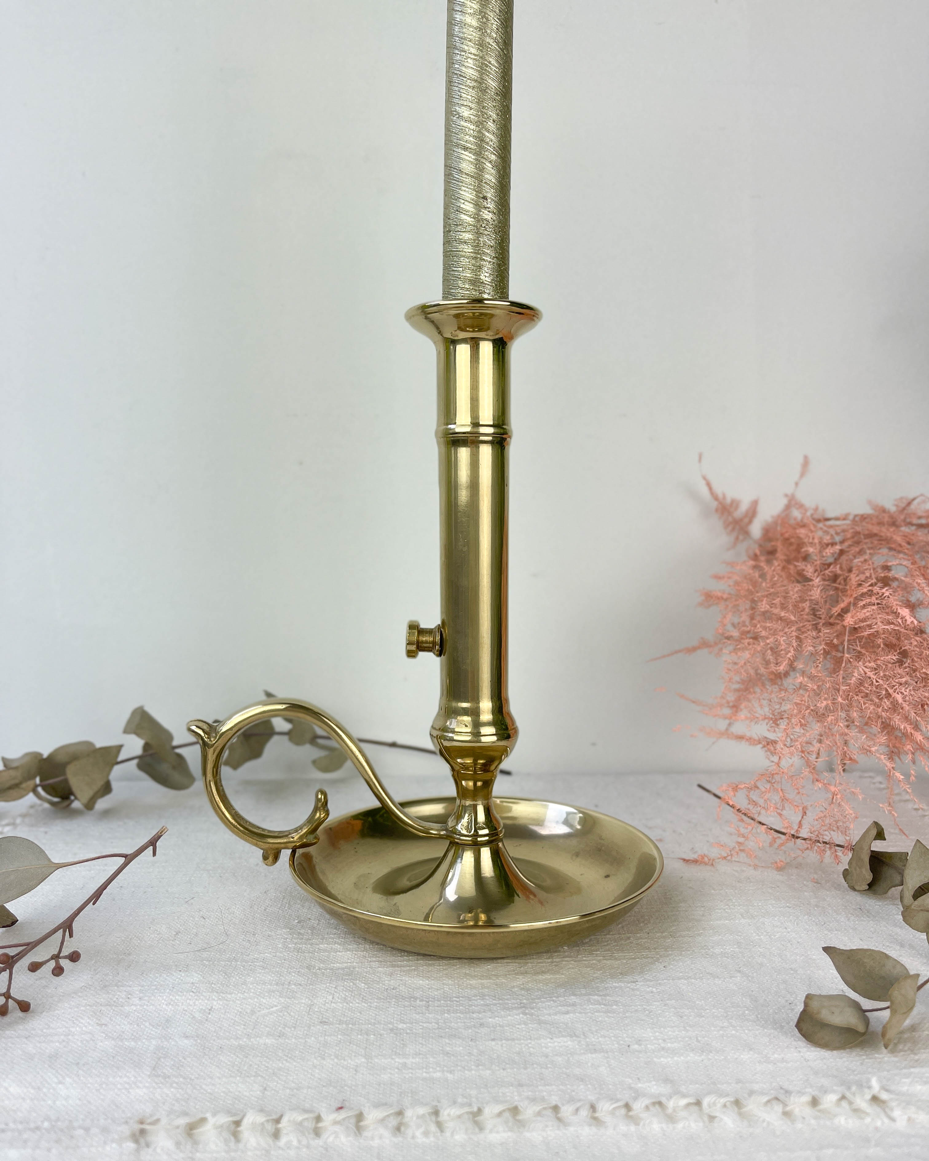 Brass candle holder with pusher late nineteenth century