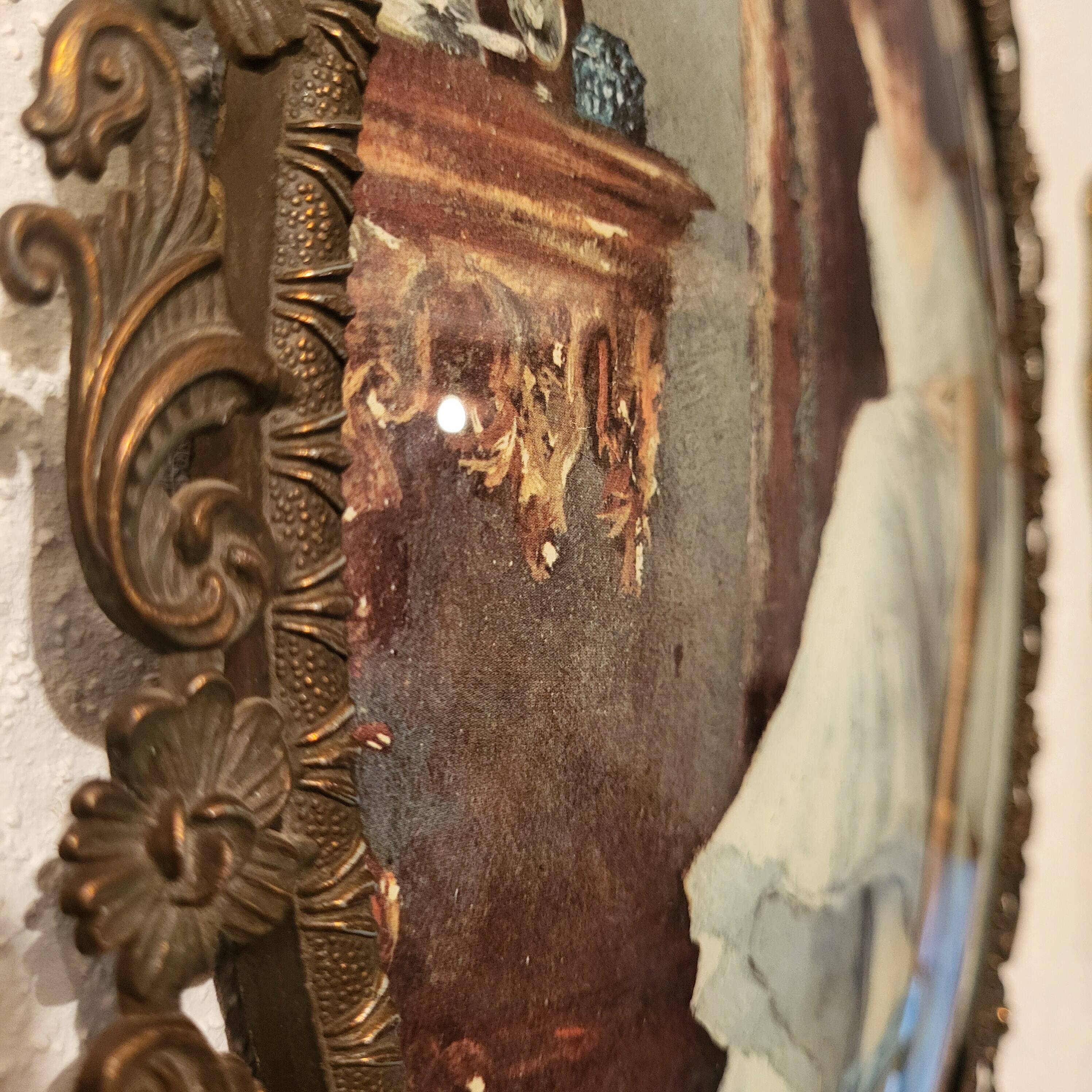 Italian oval frame in bronze and curved glass