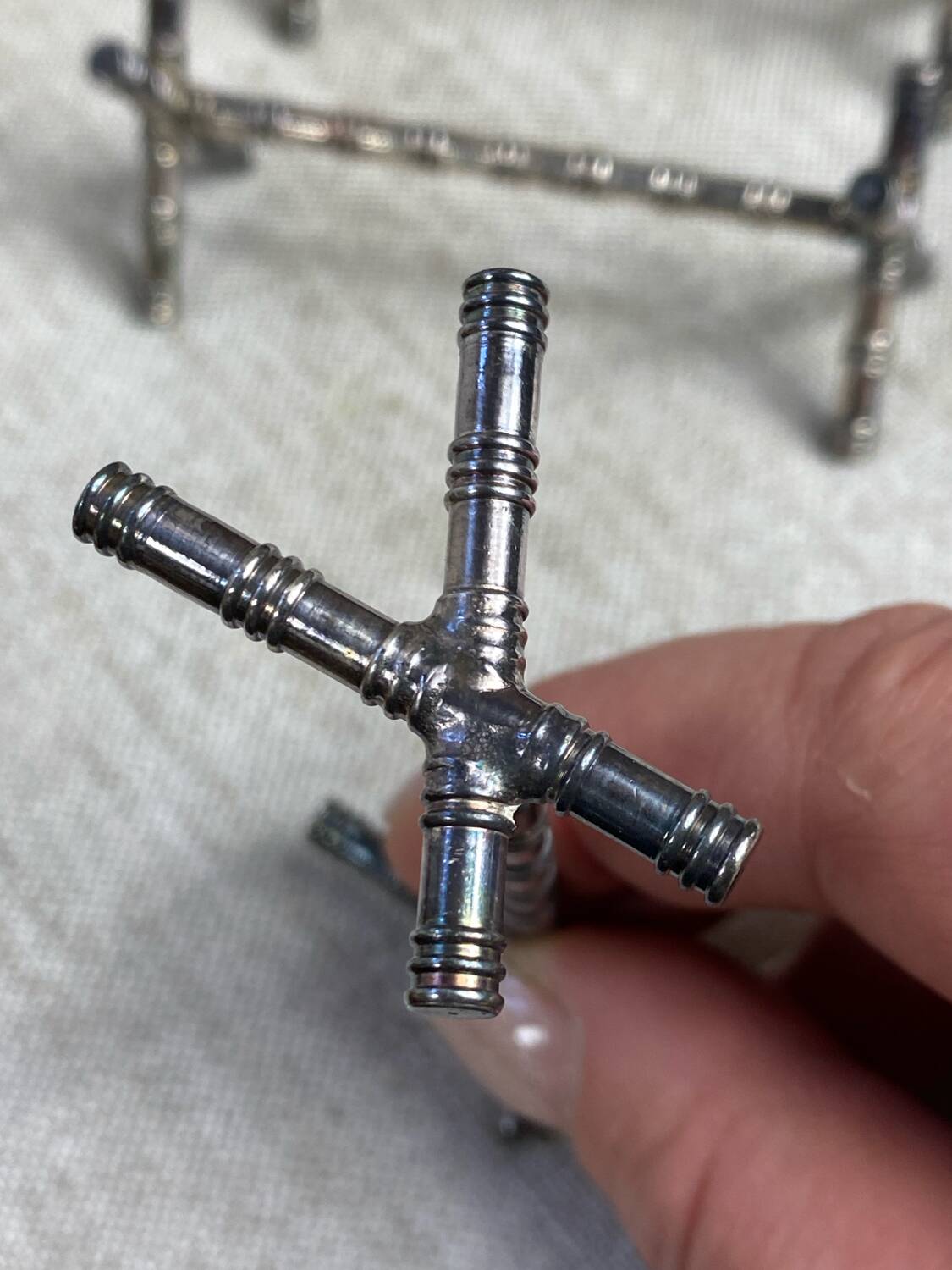 Six bamboo-patterned metal silver-plated knife rests.