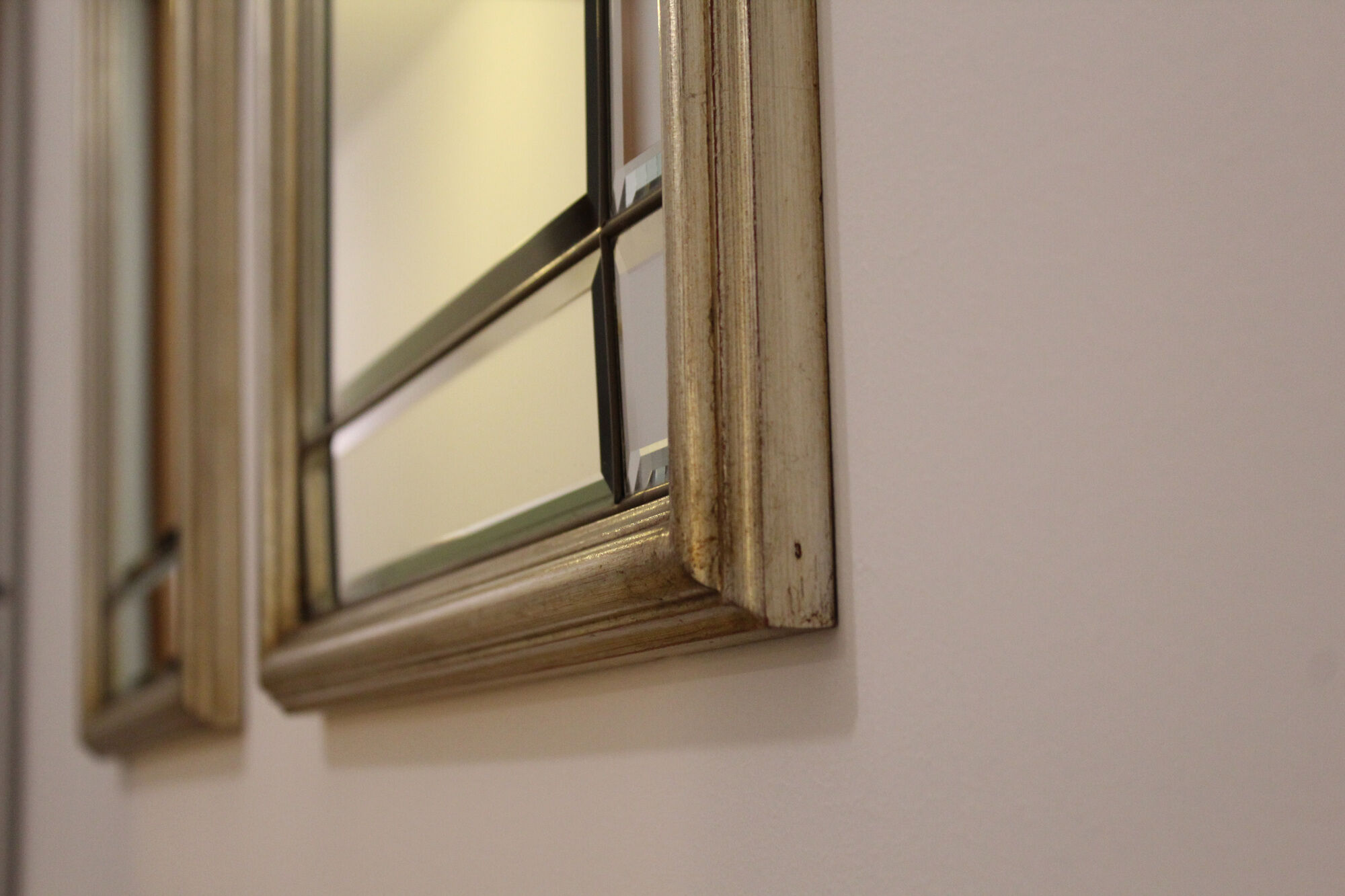 Pair of bevelled mirrors, brass edging frame in brushed wood years Italy 70's