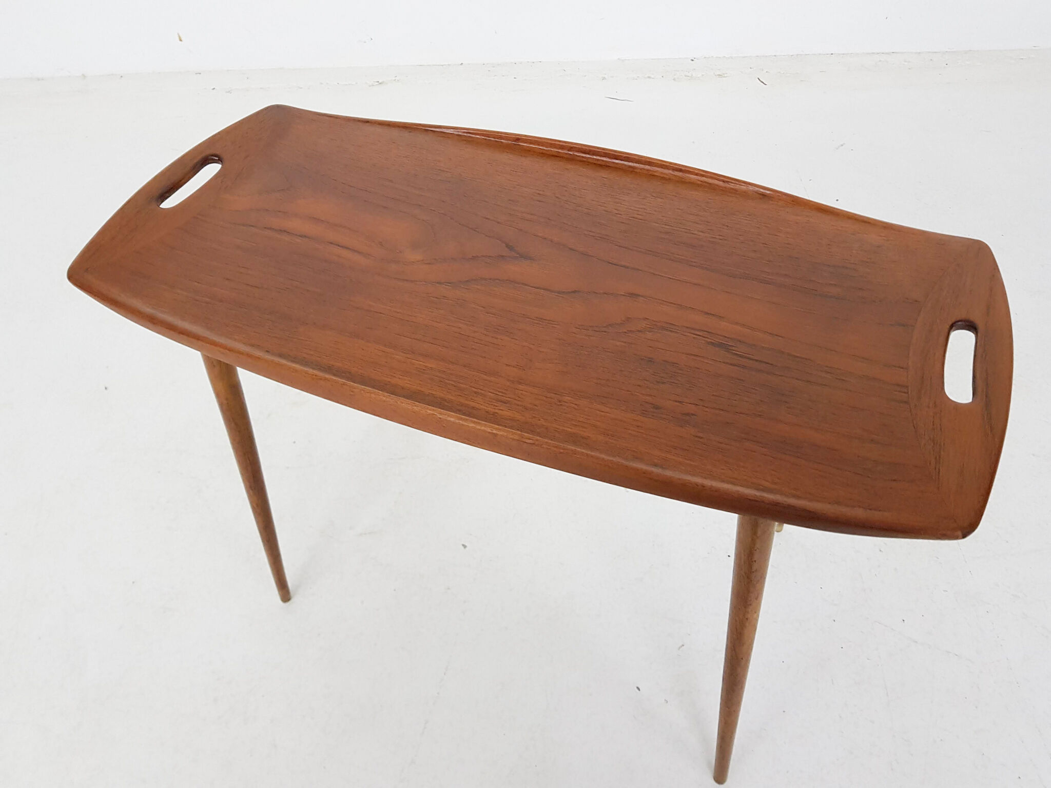 Teak side table with handles by Jens Quistgaard