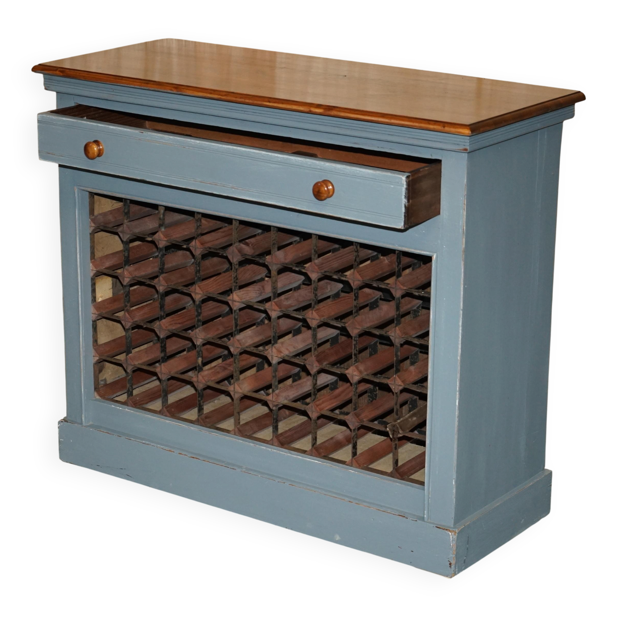 Vintage wooden furniture for 45 wine bottles with a drawer.